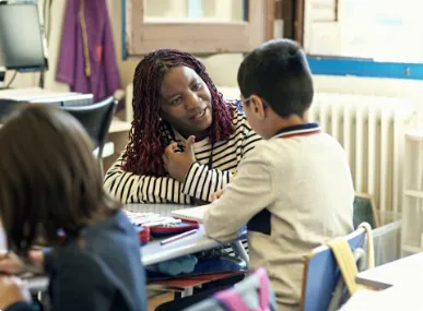 a teacher speaks to a student