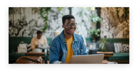 A student looks at their laptop